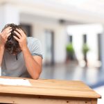 young-man-on-a-table-worried-expression_1194-4582